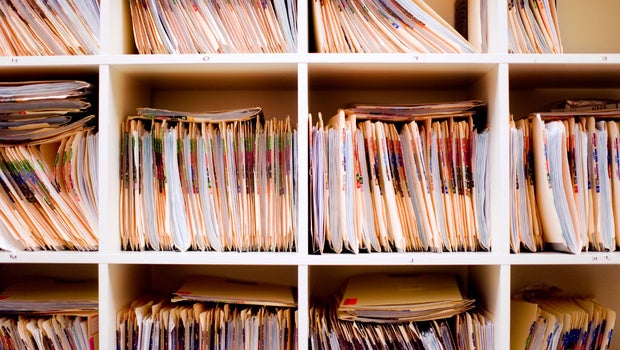 Close up image of files in shelves.